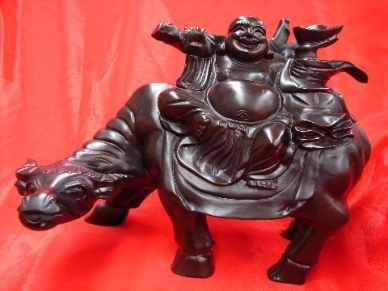 Wooden Buddha on Ox Statue