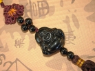 Black Stone Laughing Buddha Charm